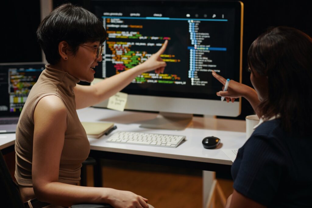 Developers Discussing Programming Code